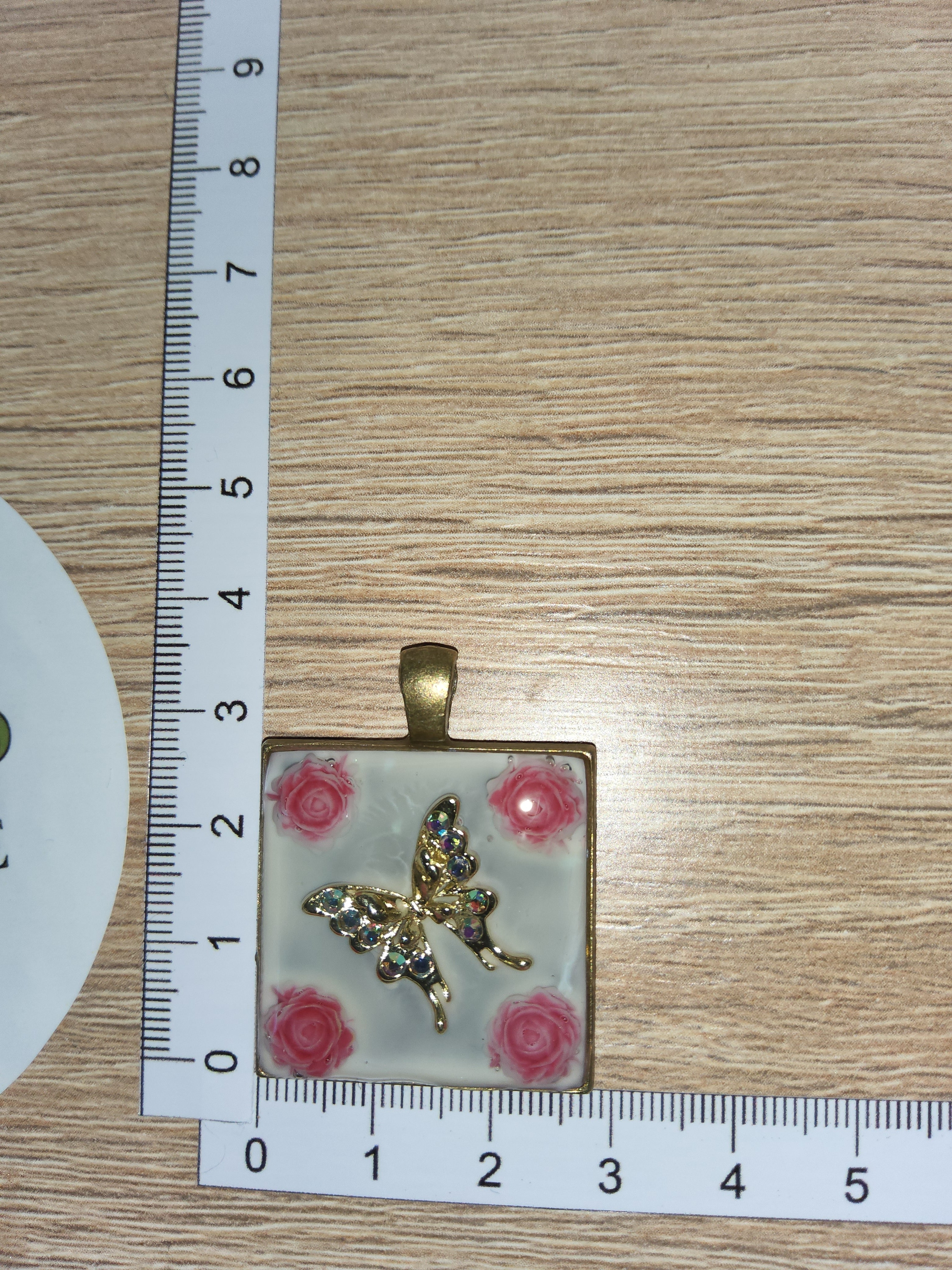 Kette mit Amulett Blüte Schmetterling
