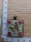 Kette mit Amulett Blüte Schmetterling