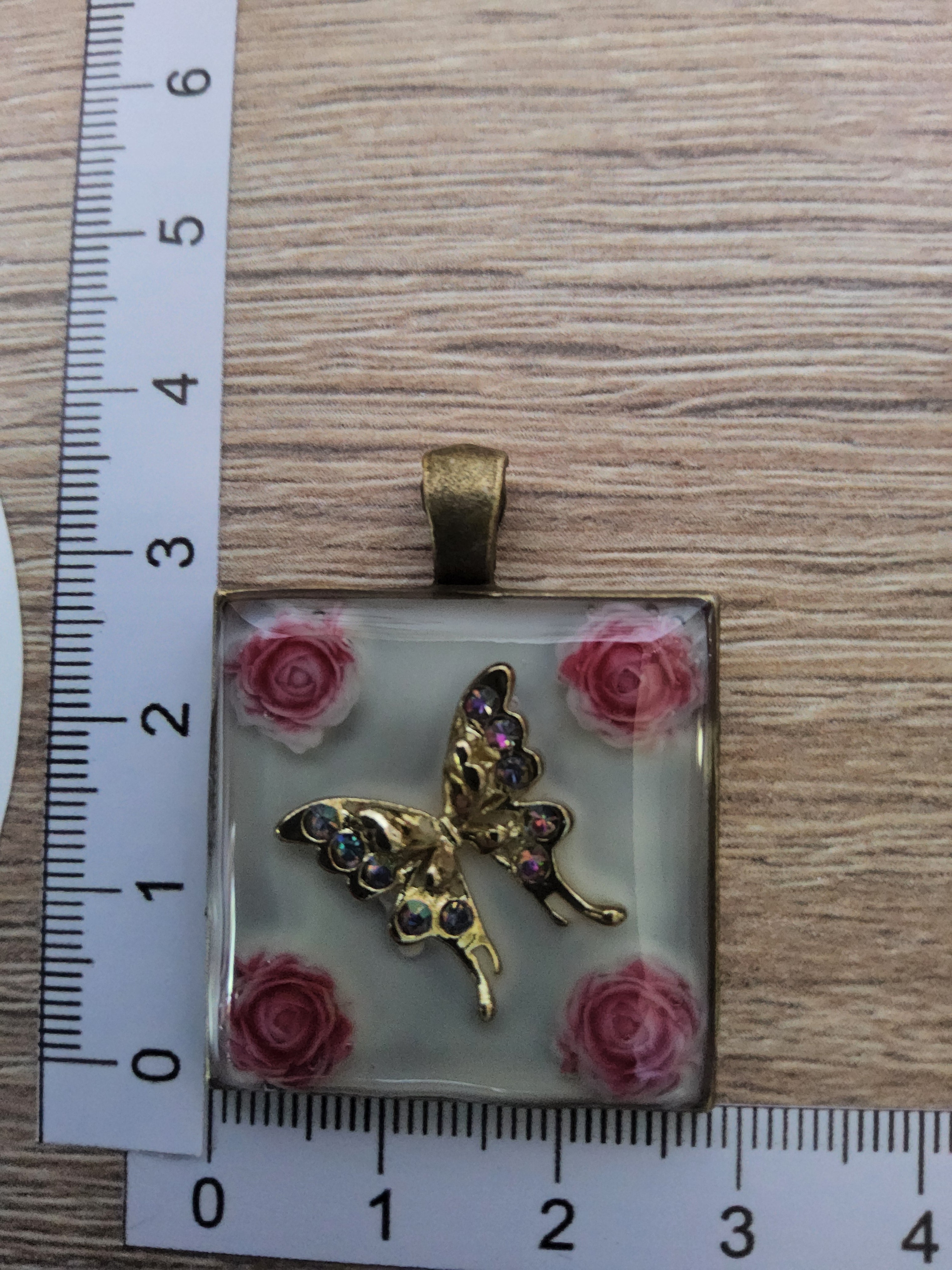 Kette mit Amulett Blüte Schmetterling