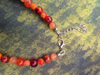 Perlenkette in orange mit Glasherz