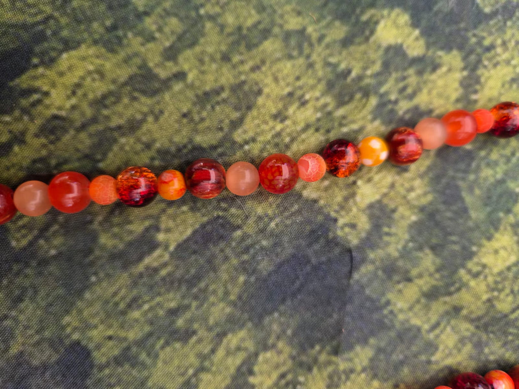 Perlenkette in orange mit Glasherz